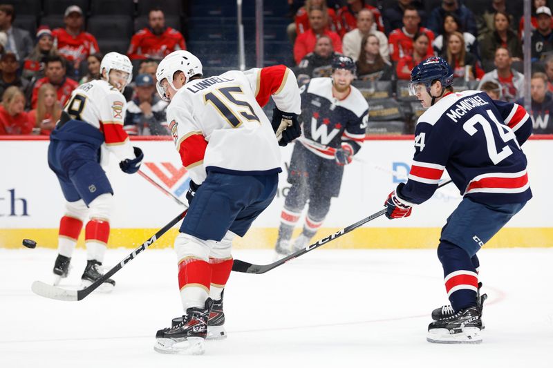 Nov 8, 2023; Washington, District of Columbia, USA; Washington Capitals right wing Anthony Mantha (39) scores a goal after a shot deflects off the stick of Florida Panthers center Anton Lundell (15) in the first period at Capital One Arena. Mandatory Credit: Geoff Burke-USA TODAY Sports