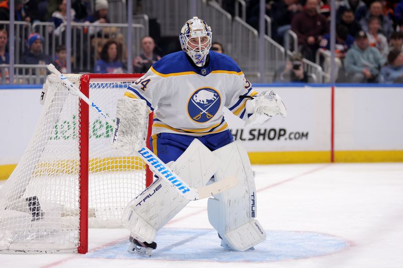 Jan 24, 2026; Elmont, New York, USA; Buffalo Sabres goaltender Alex Lyon (34) tends net against the New York Islanders during the second period at UBS Arena. Mandatory Credit: Brad Penner-Imagn Images