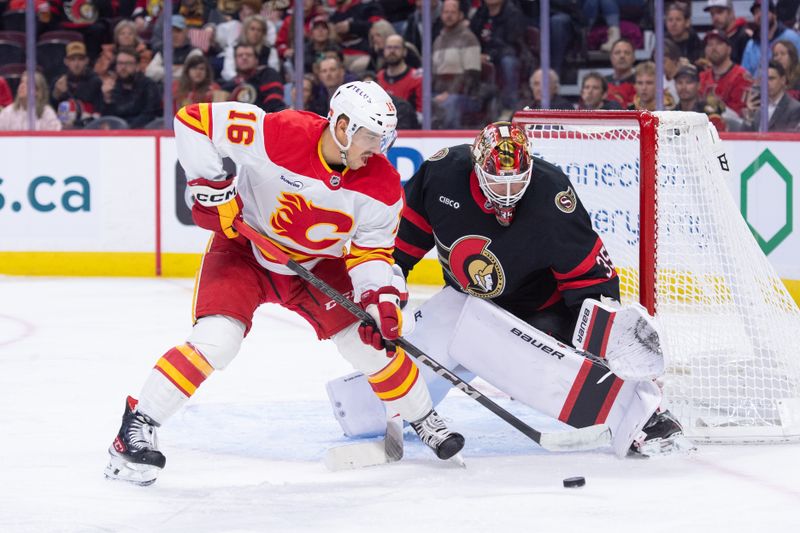 Oct 30, 2025; Ottawa, Ontario, CAN; Calgary Flames center Morgan Frost (16) is unable to capitalize on a loose puck in front of Ottawa Senators goalie Linus Ullmark (35) in the second period at the Canadian Tire Centre. Mandatory Credit: Marc DesRosiers-IMAGN Images