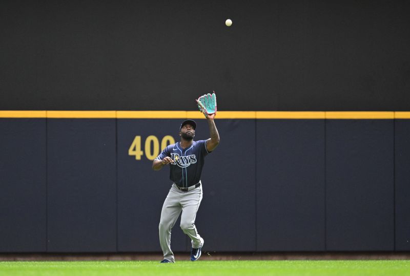 May 1, 2024; Milwaukee, Wisconsin, USA; Tampa Bay Rays outfielder Randy Arozarena (56) catches a fly ball against the Milwaukee Brewers in the third inning at American Family Field. Mandatory Credit: Michael McLoone-USA TODAY Sports