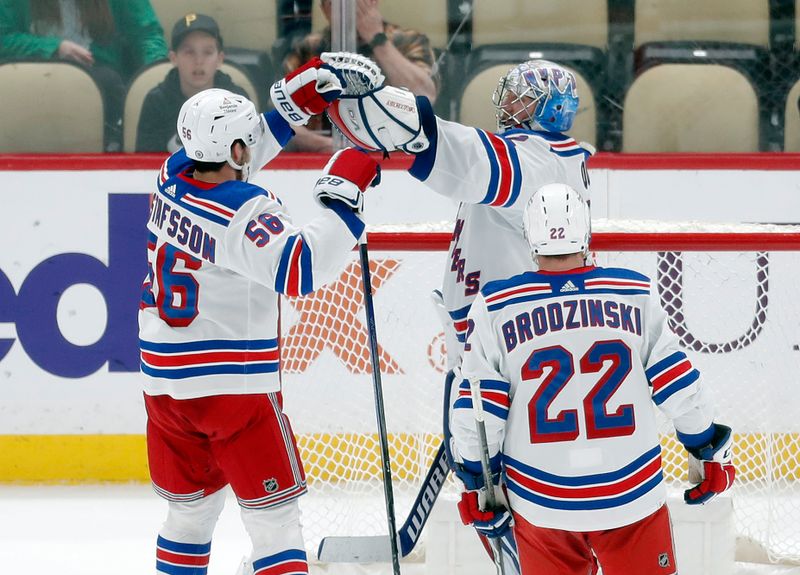 Mar 16, 2024; Pittsburgh, Pennsylvania, USA;  New York Rangers defenseman Erik Gustafsson (56) and goaltender Jonathan Quick (32) and center Jonny Brodzinski (22) celebrate after defeating he Pittsburgh Penguins at PPG Paints Arena. New York won 7-4. Mandatory Credit: Charles LeClaire-USA TODAY Sports