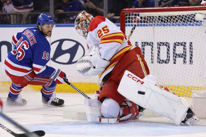 Feb 12, 2024; New York, New York, USA; Calgary Flames goaltender Jacob Markstrom (25) makes a save against New York Rangers center Vincent Trocheck (16) during the third period at Madison Square Garden. Mandatory Credit: Brad Penner-USA TODAY Sports