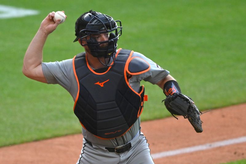 Jul 23, 2024; Cleveland, Ohio, USA; Detroit Tigers catcher Jake Rogers (34) throws to first base in the third inning against the Cleveland Guardians at Progressive Field. Mandatory Credit: David Richard-USA TODAY Sports