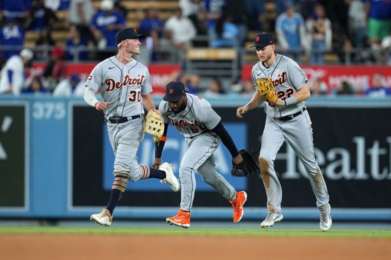 Sep 20, 2023; Los Angeles, California, USA; Detroit Tigers right fielder Kerry Carpenter (30), left fielder Akil Baddoo (60) and center fielder Parker Meadows (22) react at the end of the game against the Los Angeles Dodgers at Dodger Stadium. Mandatory Credit: Kirby Lee-USA TODAY Sports