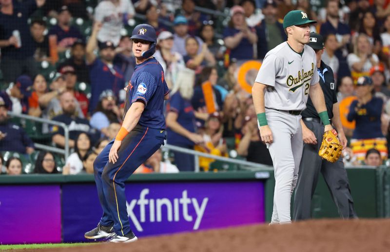 May 13, 2024; Houston, Texas, USA;Houston Astros center fielder Jake Meyers (6) steals third base against the Oakland Athletics on a throw in the seventh inning at Minute Maid Park. Mandatory Credit: Thomas Shea-USA TODAY Sports