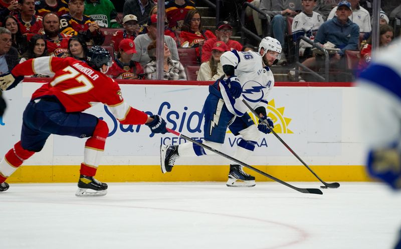 Dec 27, 2025; Sunrise, Florida, USA; Tampa Bay Lightning right wing Nikita Kucherov (86) moves the puck against the Florida Panthers during the second period at Amerant Bank Arena. Mandatory Credit: Jeff Romance-Imagn Images