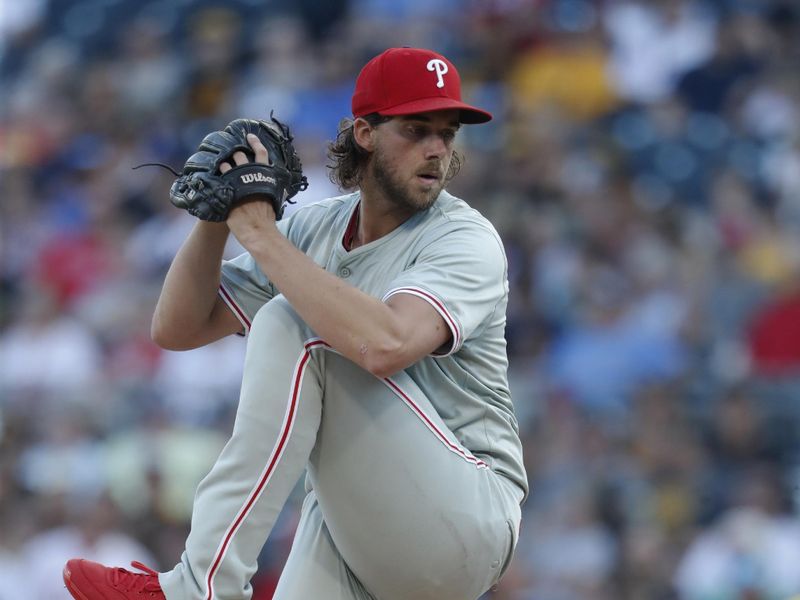 Jul 19, 2024; Pittsburgh, Pennsylvania, USA;  Philadelphia Phillies starting pitcher Aaron Nola (27) delivers a pitch against the Pittsburgh Pirates during the first inning at PNC Park. Mandatory Credit: Charles LeClaire-USA TODAY Sports