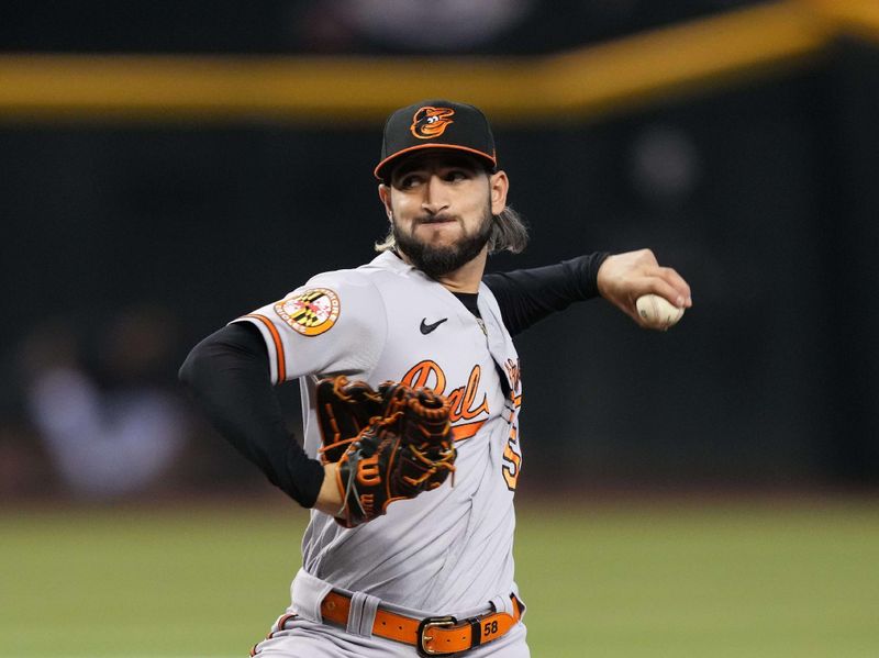 Sep 3, 2023; Phoenix, Arizona, USA; Baltimore Orioles relief pitcher Cionel Perez (58) pitches against the Arizona Diamondbacks during the seventh inning at Chase Field. Mandatory Credit: Joe Camporeale-USA TODAY Sports