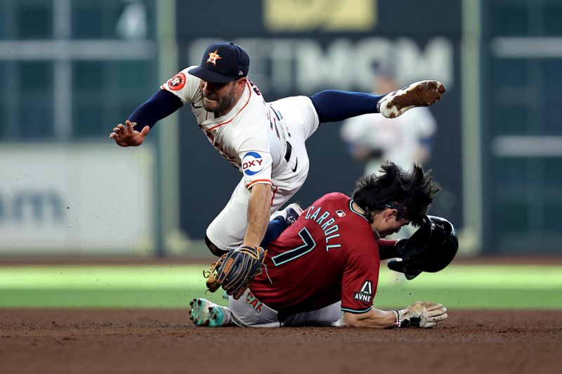 Sep 7, 2024; Houston, Texas, USA; Arizona Diamondbacks right fielder Corbin Carroll (7) runs into Houston Astros second baseman Jose Altuve (27) while sliding into second base during the fifth inning at Minute Maid Park. Mandatory Credit: Erik Williams-Imagn Images
