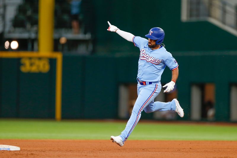 Aug 6, 2023; Arlington, Texas, USA; Texas Rangers shortstop Ezequiel Duran (20) circles the bases after hitting a home run during the sixth inning against the Miami Marlins at Globe Life Field. Mandatory Credit: Andrew Dieb-USA TODAY Sports