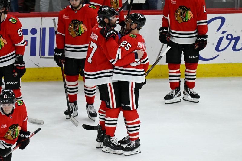 Apr 12, 2025; Chicago, Illinois, USA;  Chicago Blackhawks left wing Patrick Maroon (77) and Chicago Blackhawks defenseman Alec Martinez (25) hug after the game against the Winnipeg Jets at United Center. They both retired today. Mandatory Credit: Matt Marton-Imagn Images
