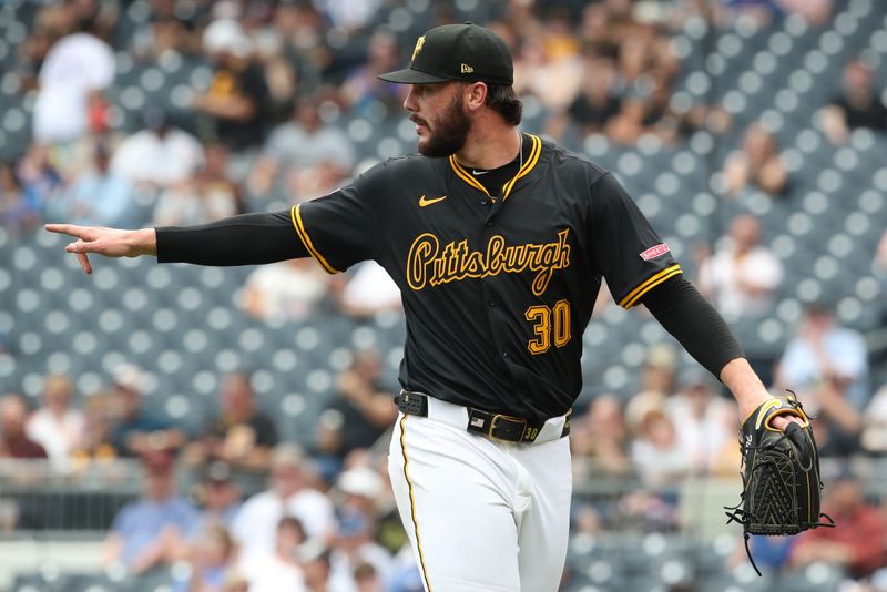 May 1, 2025; Pittsburgh, Pennsylvania, USA;  Pittsburgh Pirates starting pitcher Paul Skenes (30) reacts after a Pirates double play against the Chicago Cubs during the third inning at PNC Park. Mandatory Credit: Charles LeClaire-Imagn Images