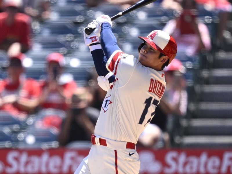 Aug 23, 2023; Anaheim, California, USA; Los Angeles Angels starting pitcher Shohei Ohtani (17) hits a two-run home run against the Cincinnati Reds during the first inning at Angel Stadium. Mandatory Credit: Orlando Ramirez-USA TODAY Sports