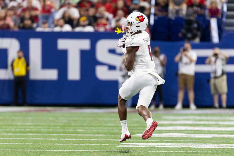 Sep 16, 2023; Indianapolis, Indiana, USA; Louisville Cardinals wide receiver Jamari Thrash (1) catches the ball before running for a touchdown against the Indiana Hoosiers in the first quarter at Lucas Oil Stadium. Mandatory Credit: Trevor Ruszkowski-USA TODAY Sports