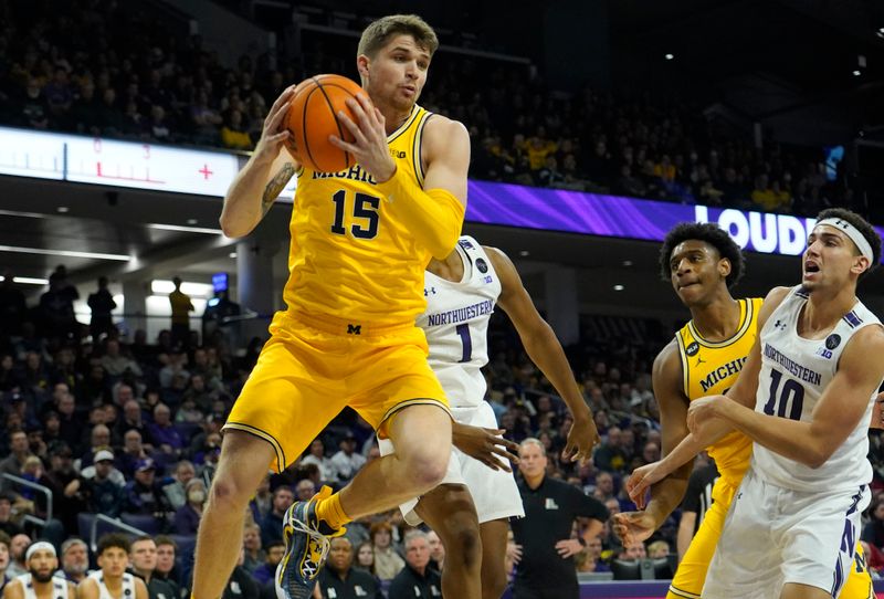 Feb 2, 2023; Evanston, Illinois, USA; Michigan Wolverines guard Joey Baker (15) grabs a rebound against the Northwestern Wildcats during the first half at Welsh-Ryan Arena. Mandatory Credit: David Banks-USA TODAY Sports