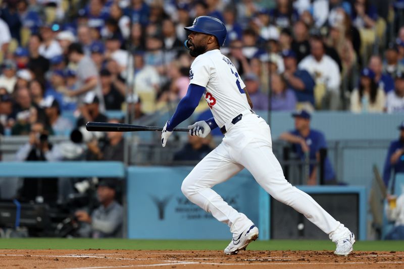 Jun 1, 2024; Los Angeles, California, USA;  Los Angeles Dodgers right fielder Jason Heyward (23) hits an RBI double during the second inning against the Colorado Rockies at Dodger Stadium. Mandatory Credit: Kiyoshi Mio-USA TODAY Sports