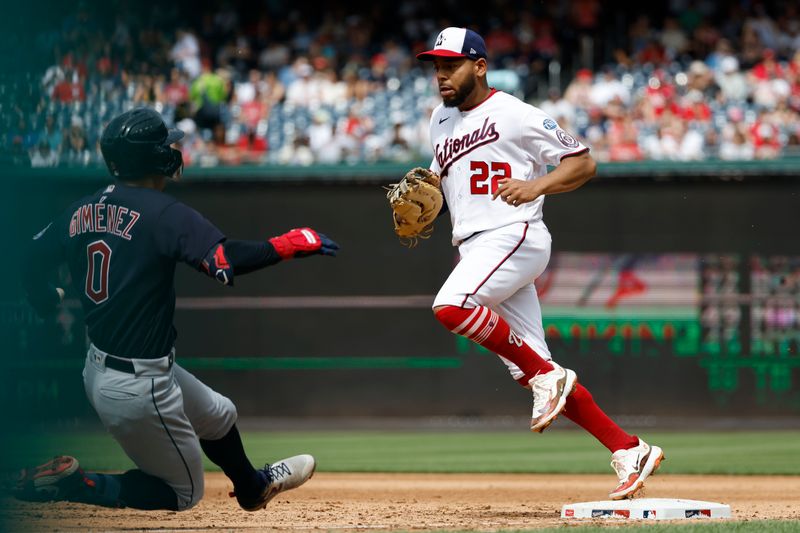 Apr 16, 2023; Washington, District of Columbia, USA; Washington Nationals first baseman Dominic Smith (22) touches first base after fielding a ground ball by Cleveland Guardians second baseman Andres Gimenez (0) during the sixth inning at Nationals Park. Mandatory Credit: Geoff Burke-USA TODAY Sports