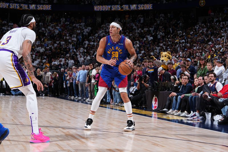 DENVER, CO - APRIL 20: Aaron Gordon #50 of the Denver Nuggets dribbles the ball during the game against the Los Angeles Lakers during Round 1 Game 1 of the 2024 NBA Playoffs on April 20, 2024 at the Ball Arena in Denver, Colorado. NOTE TO USER: User expressly acknowledges and agrees that, by downloading and/or using this Photograph, user is consenting to the terms and conditions of the Getty Images License Agreement. Mandatory Copyright Notice: Copyright 2024 NBAE (Photo by Garrett Ellwood/NBAE via Getty Images)