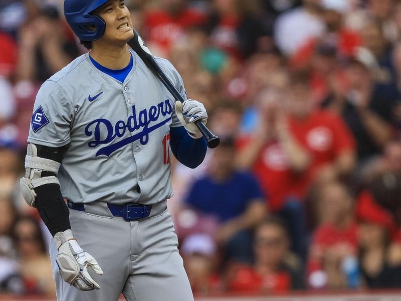 May 25, 2024; Cincinnati, Ohio, USA; Los Angeles Dodgers designated hitter Shohei Ohtani (17) reacts after striking out in the first inning against the Cincinnati Reds at Great American Ball Park. Mandatory Credit: Katie Stratman-USA TODAY Sports
