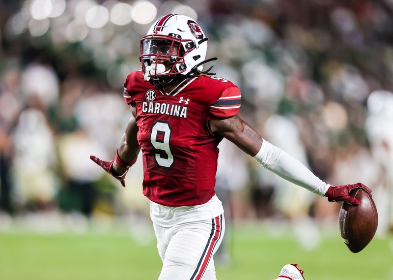 Sep 24, 2022; Columbia, South Carolina, USA; South Carolina Gamecocks defensive back Cam Smith (9) celebrates an interception against the Charlotte 49ers in the second half at Williams-Brice Stadium. Mandatory Credit: Jeff Blake-USA TODAY Sports