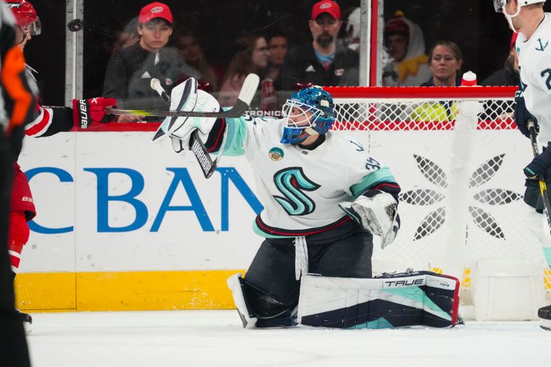 Oct 26, 2023; Raleigh, North Carolina, USA; Seattle Kraken goaltender Joey Daccord (35) makes a blocker save against the Carolina Hurricanes during the second period at PNC Arena. Mandatory Credit: James Guillory-USA TODAY Sports