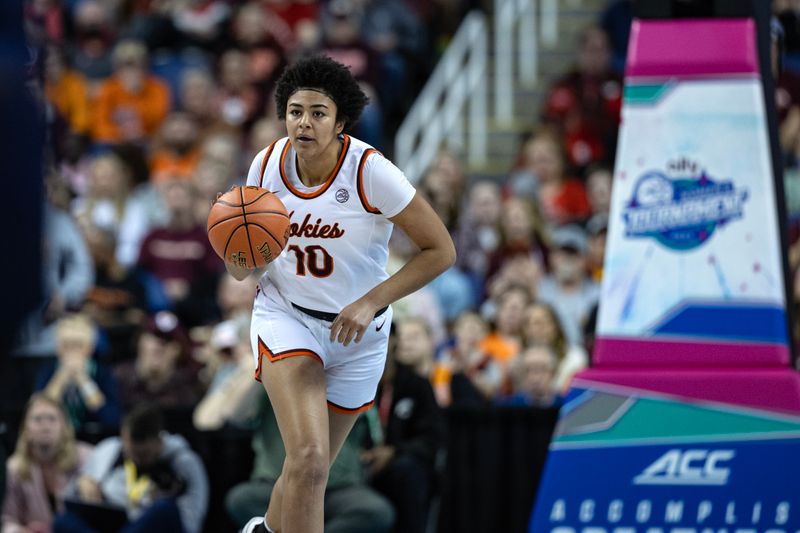 Mar 9, 2024; Greensboro, NC, USA; Virginia Tech Hokies forward Carys Baker (10) brings the ball up court in the first half against the Notre Dame Fighting Irish at Greensboro Coliseum. Mandatory Credit: David Yeazell-USA TODAY Sports