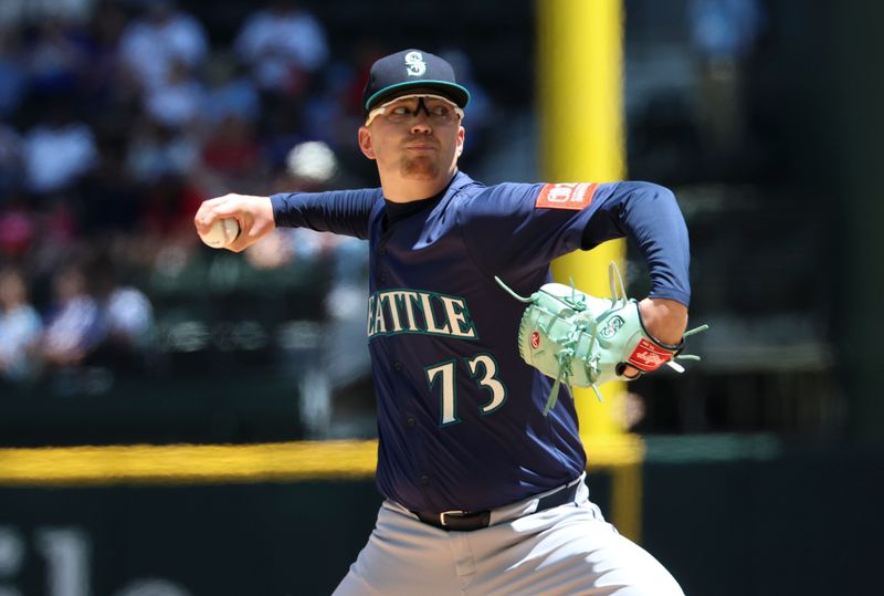 May 4, 2025; Arlington, Texas, USA;  Seattle Mariners starting pitcher Logan Evans (73) throws during the first inning against the Texas Rangers at Globe Life Field. Mandatory Credit: Kevin Jairaj-Imagn Images