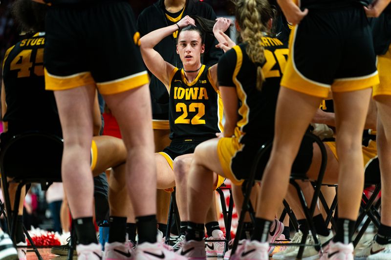 Feb 11, 2024; Lincoln, Nebraska, USA; Iowa Hawkeyes guard Caitlin Clark (22) during a timeout in the second quarter against the Nebraska Cornhuskers at Pinnacle Bank Arena. Mandatory Credit: Dylan Widger-USA TODAY Sports