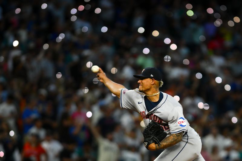 Jul 19, 2024; Seattle, Washington, USA; Houston Astros relief pitcher Bryan Abreu (52) throws a warmup pitch during the seventh inning against the Seattle Mariners at T-Mobile Park. Mandatory Credit: Steven Bisig-USA TODAY Sports