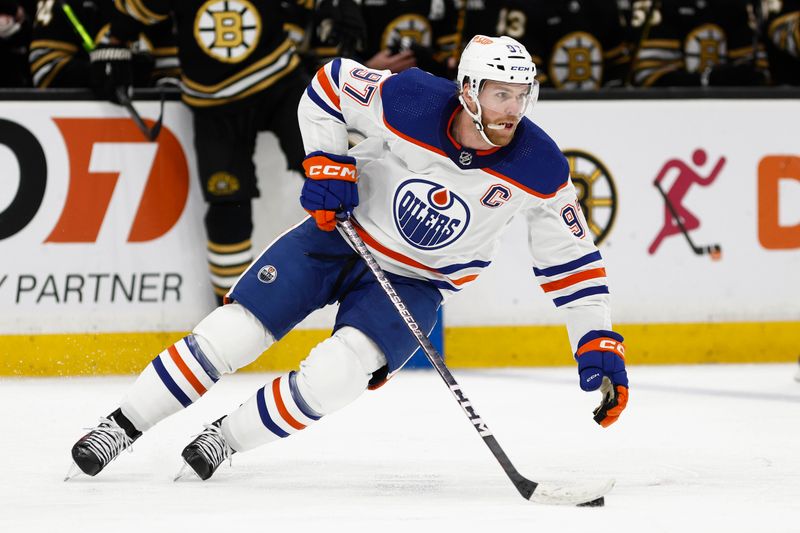 Mar 5, 2024; Boston, Massachusetts, USA; Edmonton Oilers center Connor McDavid (97) turns to go up ice with the puck during the second period against the Boston Bruins at TD Garden. Mandatory Credit: Winslow Townson-USA TODAY Sports