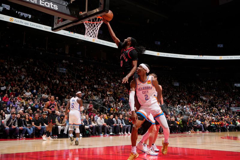 TORONTO, CANADA - MARCH 22:  Javon Freeman-Liberty #0 of the Toronto Raptors drives to the basket during the game against the Oklahoma City Thunder on March 22, 2024 at the Scotiabank Arena in Toronto, Ontario, Canada.  NOTE TO USER: User expressly acknowledges and agrees that, by downloading and or using this Photograph, user is consenting to the terms and conditions of the Getty Images License Agreement.  Mandatory Copyright Notice: Copyright 2024 NBAE (Photo by Mark Blinch/NBAE via Getty Images)