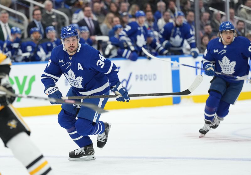 Apr 8, 2024; Toronto, Ontario, CAN; Toronto Maple Leafs center Auston Matthews (34) skates up ice against the Pittsburgh Penguins during the first period at Scotiabank Arena. Mandatory Credit: Nick Turchiaro-USA TODAY Sports