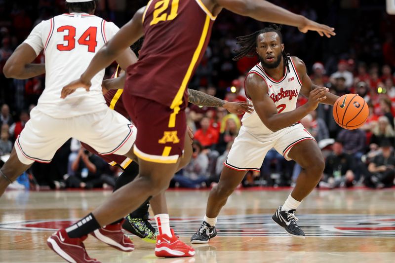 Dec 3, 2023; Columbus, Ohio, USA;  Ohio State Buckeyes guard Bruce Thornton (2) controls the ball as Minnesota Golden Gophers forward Pharrel Payne (21) defends him on the play during the second half at Value City Arena. Mandatory Credit: Joseph Maiorana-USA TODAY Sports