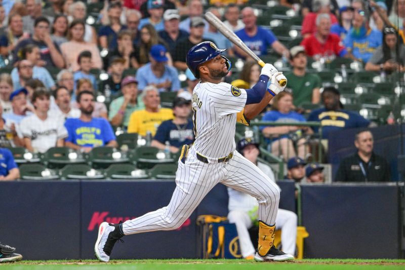 Jul 28, 2024; Milwaukee, Wisconsin, USA; Milwaukee Brewers left fielder Jackson Chourio (11) hits a solo home run in the fifth inning against the Miami Marlins at American Family Field. Mandatory Credit: Benny Sieu-USA TODAY Sports