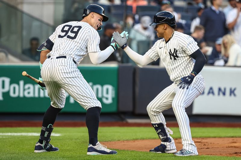 Aug 21, 2024; Bronx, New York, USA;  New York Yankees right fielder Juan Soto (22) celebrates with center fielder Aaron Judge (99) after hitting a two run home run in the first inning against the Cleveland Guardians at Yankee Stadium. Mandatory Credit: Wendell Cruz-USA TODAY Sports