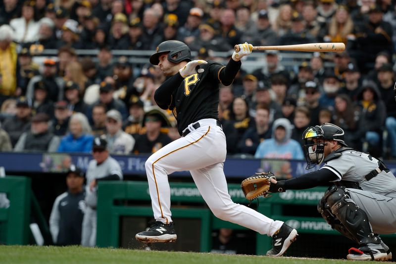 Apr 7, 2023; Pittsburgh, Pennsylvania, USA;  Pittsburgh Pirates catcher Jason Delay (55) hits a single against the Chicago White Sox during the fourth inning at PNC Park. Mandatory Credit: Charles LeClaire-USA TODAY Sports