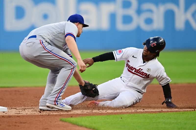 Sep 15, 2023; Cleveland, Ohio, USA; Cleveland Guardians third baseman Jose Ramirez (21) is caught stealing by Texas Rangers shortstop Corey Seager (5) during the first inning at Progressive Field. Mandatory Credit: Ken Blaze-USA TODAY Sports