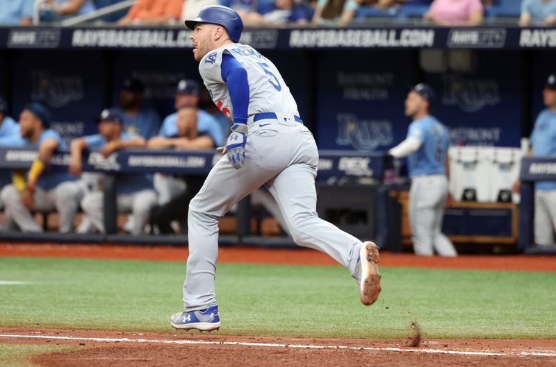 May 28, 2023; St. Petersburg, Florida, USA; Los Angeles Dodgers first baseman Freddie Freeman (5) doubles during the third inning against the Tampa Bay Rays at Tropicana Field. Mandatory Credit: Kim Klement-USA TODAY Sports