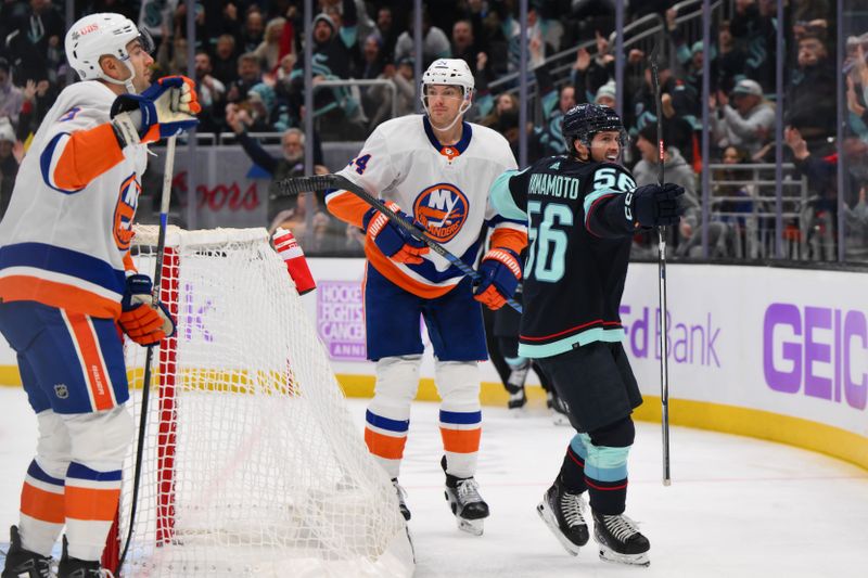 Nov 16, 2023; Seattle, Washington, USA; Seattle Kraken right wing Kailer Yamamoto (56) celebrates after scoring a goal against the New York Islanders during the third period at Climate Pledge Arena. Mandatory Credit: Steven Bisig-USA TODAY Sports