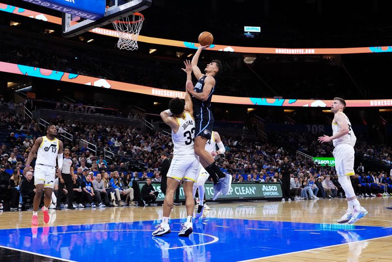 ORLANDO, FLORIDA - JANUARY 05: Tristan da Silva #23 of the Orlando Magic goes up for a shot against Johnny Juzang #33 of the Utah Jazz during the first quarter at Kia Center on January 05, 2025 in Orlando, Florida. NOTE TO USER: User expressly acknowledges and agrees that, by downloading and or using this photograph, User is consenting to the terms and conditions of the Getty Images License Agreement. (Photo by Rich Storry/Getty Images)