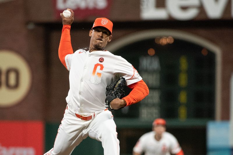 Aug 13, 2024; San Francisco, California, USA;  San Francisco Giants pitcher Randy Rodríguez (73) throws a pitch against the Atlanta Braves during the tenth inning at Oracle Park. Mandatory Credit: Ed Szczepanski-USA TODAY Sports