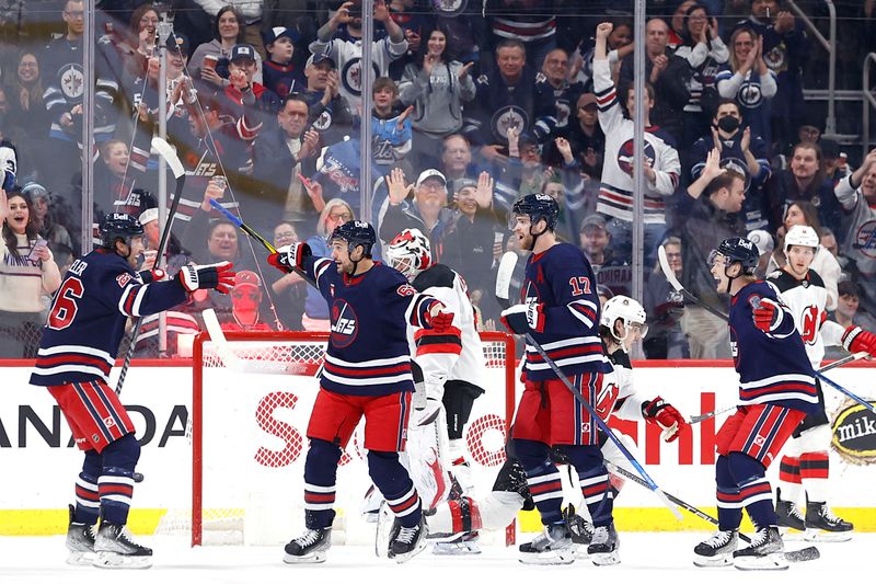 Apr 2, 2023; Winnipeg, Manitoba, CAN; Winnipeg Jets right wing Nino Niederreiter (62) celebrates his first period goal against the New Jersey Devils at Canada Life Centre. Mandatory Credit: James Carey Lauder-USA TODAY Sports