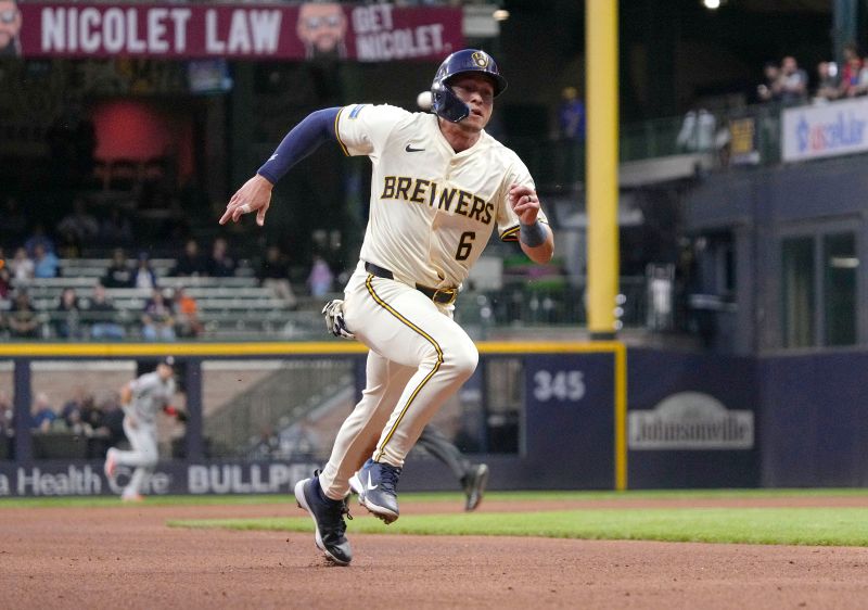 May 6, 2025; Milwaukee, Wisconsin, USA; Milwaukee Brewers outfielder Isaac Collins (6) runs into third base safely against the Houston Astros in the fourth inning at American Family Field. Mandatory Credit: Michael McLoone-Imagn Images