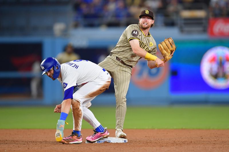 Sep 24, 2024; Los Angeles, California, USA; Los Angeles Dodgers third base Enrique Hernández (8) is out at second as San Diego Padres second baseman Jake Cronenworth (9) throws to first for the out against Los Angeles Dodgers shortstop Miguel Rojas (11) during the ninth inning at Dodger Stadium. The sequence was part of a triple play. Mandatory Credit: Gary A. Vasquez-Imagn Images