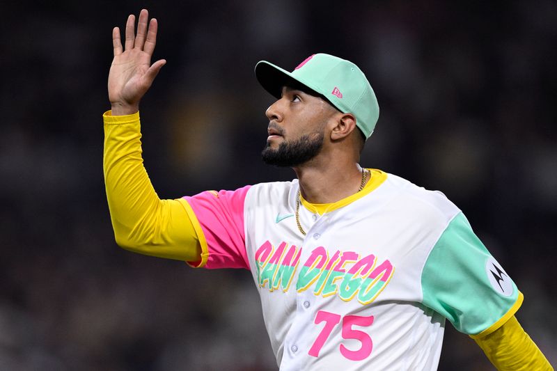 Sep 22, 2023; San Diego, California, USA; San Diego Padres relief pitcher Robert Suarez (75) celebrates after pitching during the eighth inning against the St. Louis Cardinals at Petco Park. Mandatory Credit: Orlando Ramirez-USA TODAY Sports