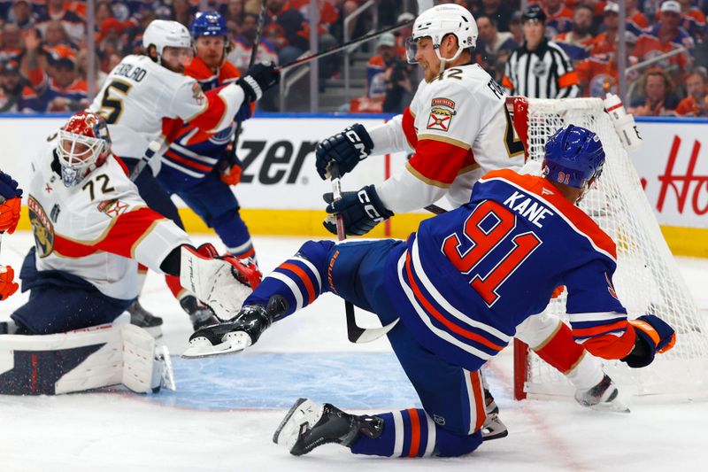 Jun 4, 2025; Edmonton, Alberta, CAN; Edmonton Oilers left wing Evander Kane (91) shoots the puck against the Florida Panthers during the first period in game one of the 2025 Stanley Cup Final at Rogers Place. Mandatory Credit: Perry Nelson-Imagn Images