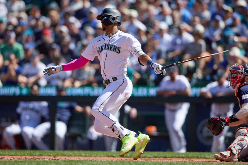 Aug 2, 2023; Seattle, Washington, USA; Seattle Mariners  Julio Rodriguez breaks his bat hitting an RBI single against the Boston Red Sox suring the seventh inning at T-Mobile Park. Mandatory Credit: John Froschauer-USA TODAY Sports