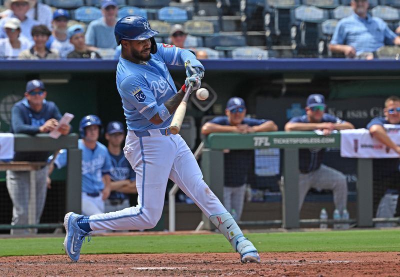 Jun 26, 2025; Kansas City, Missouri, USA;  Kansas City Royals third base Maikel Garcia (11) singles in the seventh inning against the Tampa Bay Rays at Kauffman Stadium. Mandatory Credit: Peter Aiken-Imagn Images