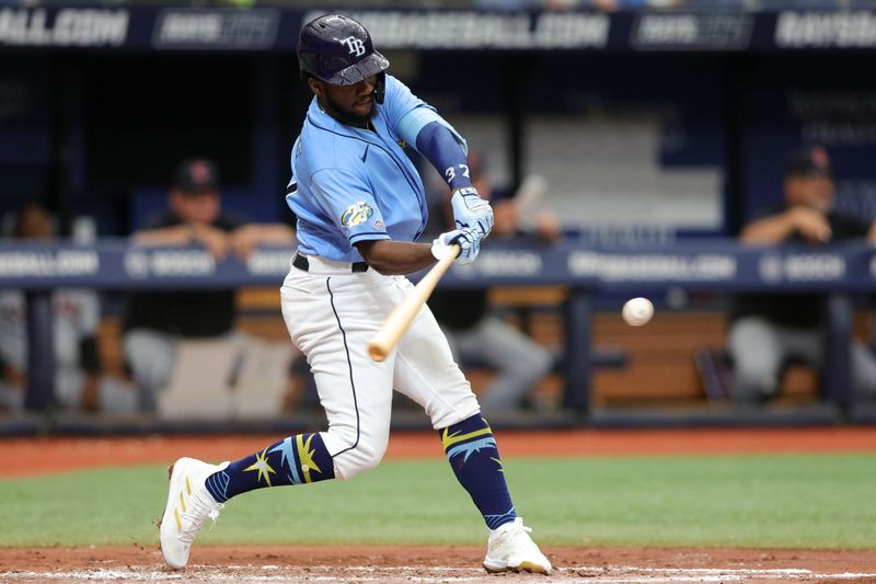 Aug 13, 2023; St. Petersburg, Florida, USA;  Tampa Bay Rays shortstop Oslevivis Basabe (37) doubles against the Cleveland Guardians in the third inning at Tropicana Field. Mandatory Credit: Nathan Ray Seebeck-USA TODAY Sports