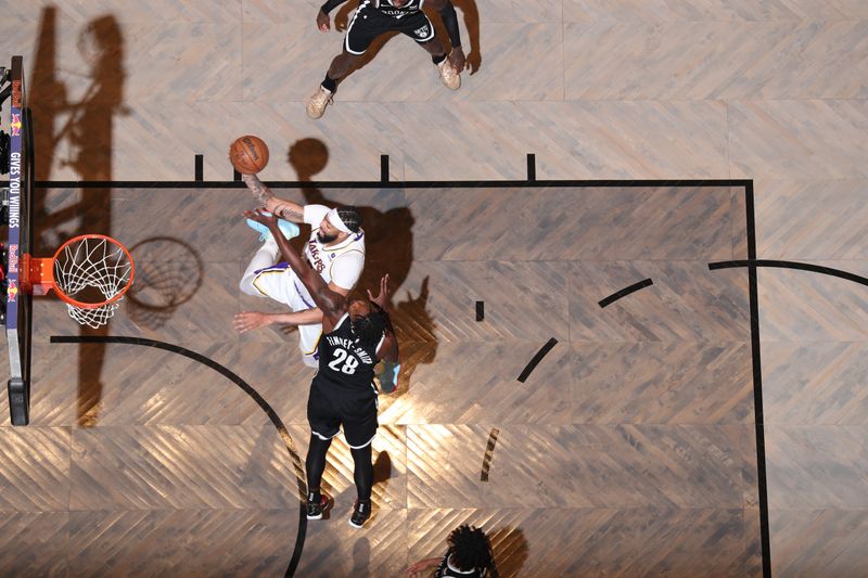 BROOKLYN, NY - MARCH 31: Anthony Davis #3 of the Los Angeles Lakers goes to the basket during the game on March 31, 2024 at Barclays Center in Brooklyn, New York. NOTE TO USER: User expressly acknowledges and agrees that, by downloading and or using this Photograph, user is consenting to the terms and conditions of the Getty Images License Agreement. Mandatory Copyright Notice: Copyright 2024 NBAE (Photo by Nathaniel S. Butler/NBAE via Getty Images)